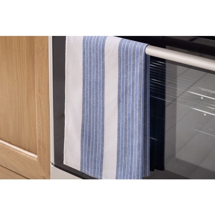 Multi-stripe blue tea towel made from 100% cotton hanging off an oven door